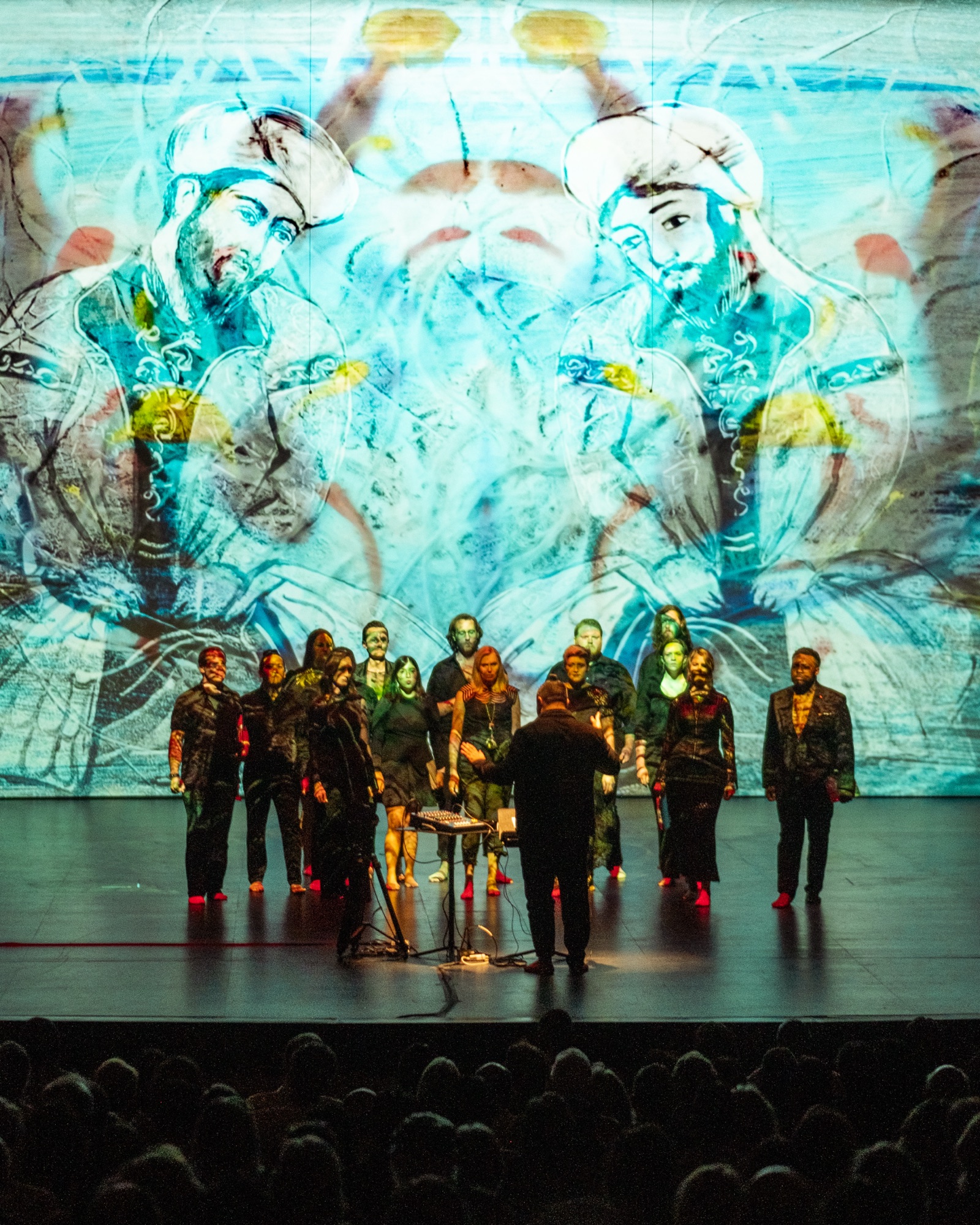 Verdigris Ensemble performing SHAMS in front of a projected image of Rumi and Shams